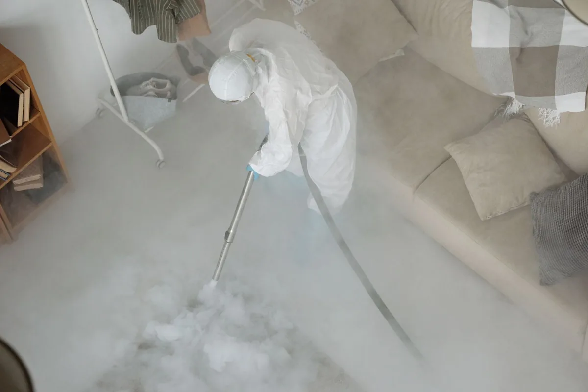 Biohazard cleanup technician in protective equipment, Wacousta, MI